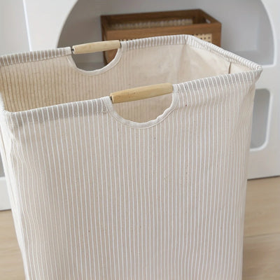 Laundry hamper featuring dual handles for easy transport and efficient home organization.