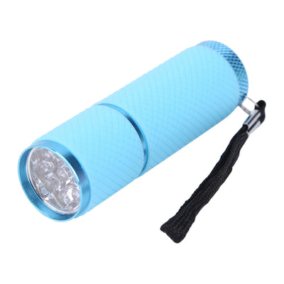 Blue flashlight with a black strap on a white background