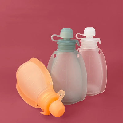 Three silicone pouches with different colours on a red background